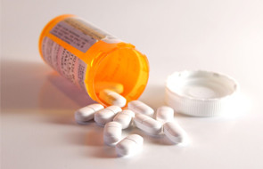 Prescription Pain Pills spilling out of a bottle